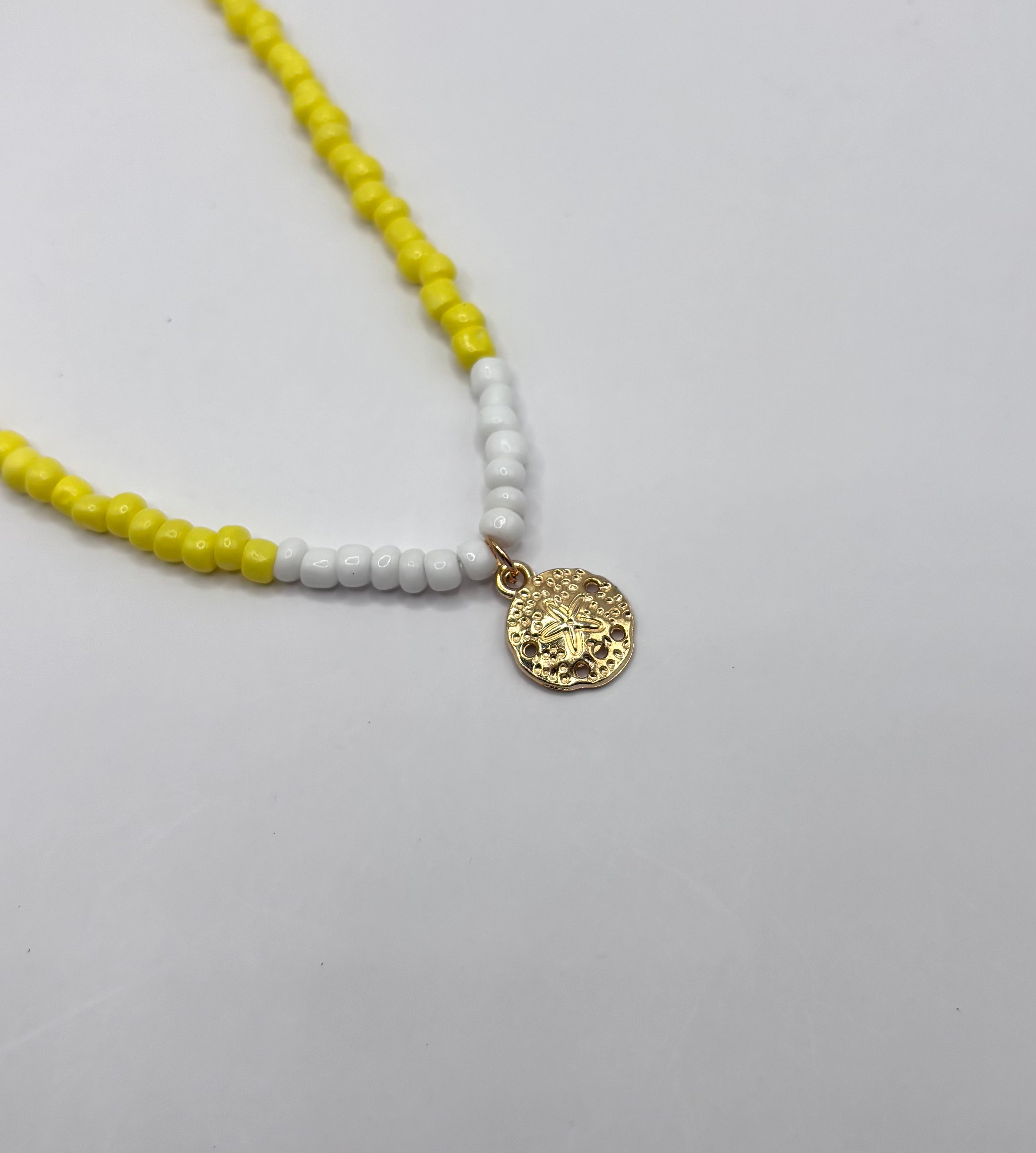 Gele ketting met munt hanger