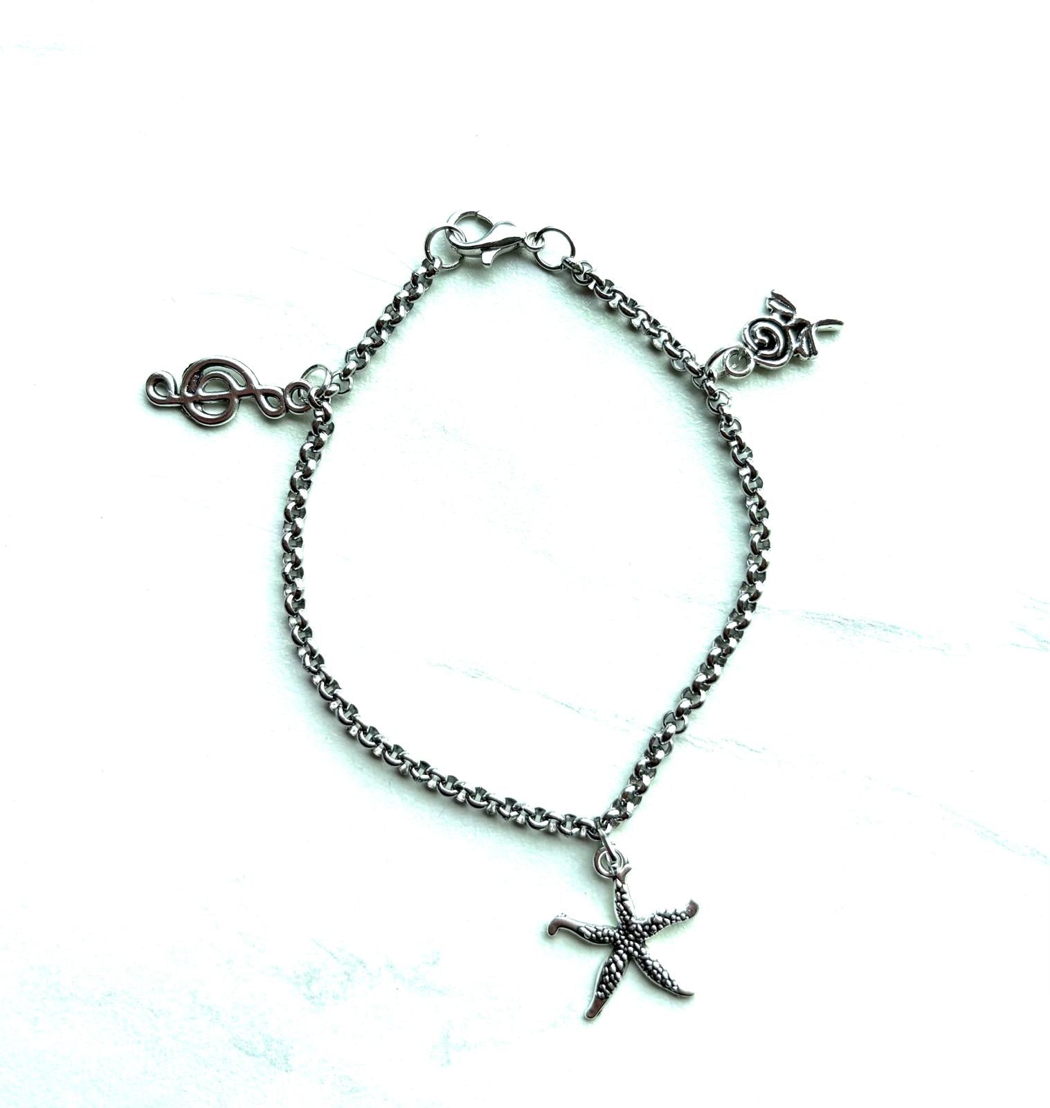Armband met Zeester Bloem Muzieknoot Bedeltjes 18cm zilverkleurig - Thema Charms