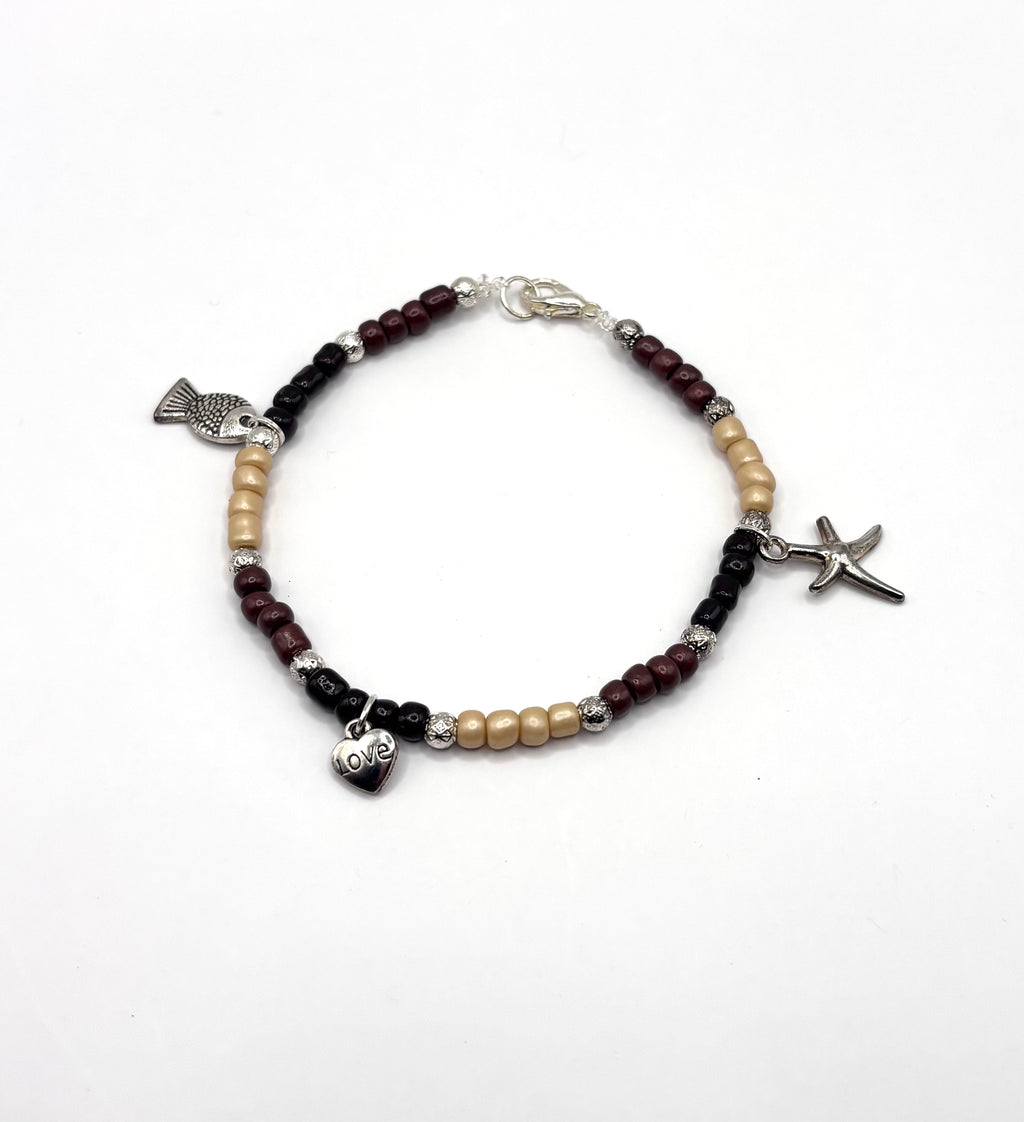 kralen armband met bedeltjes vis zeester hart