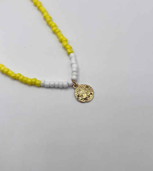 Gele ketting met munt hanger