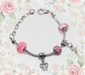 Bedelarmband The KING wisselbare bedeltjes zilverkleur met roze bedel