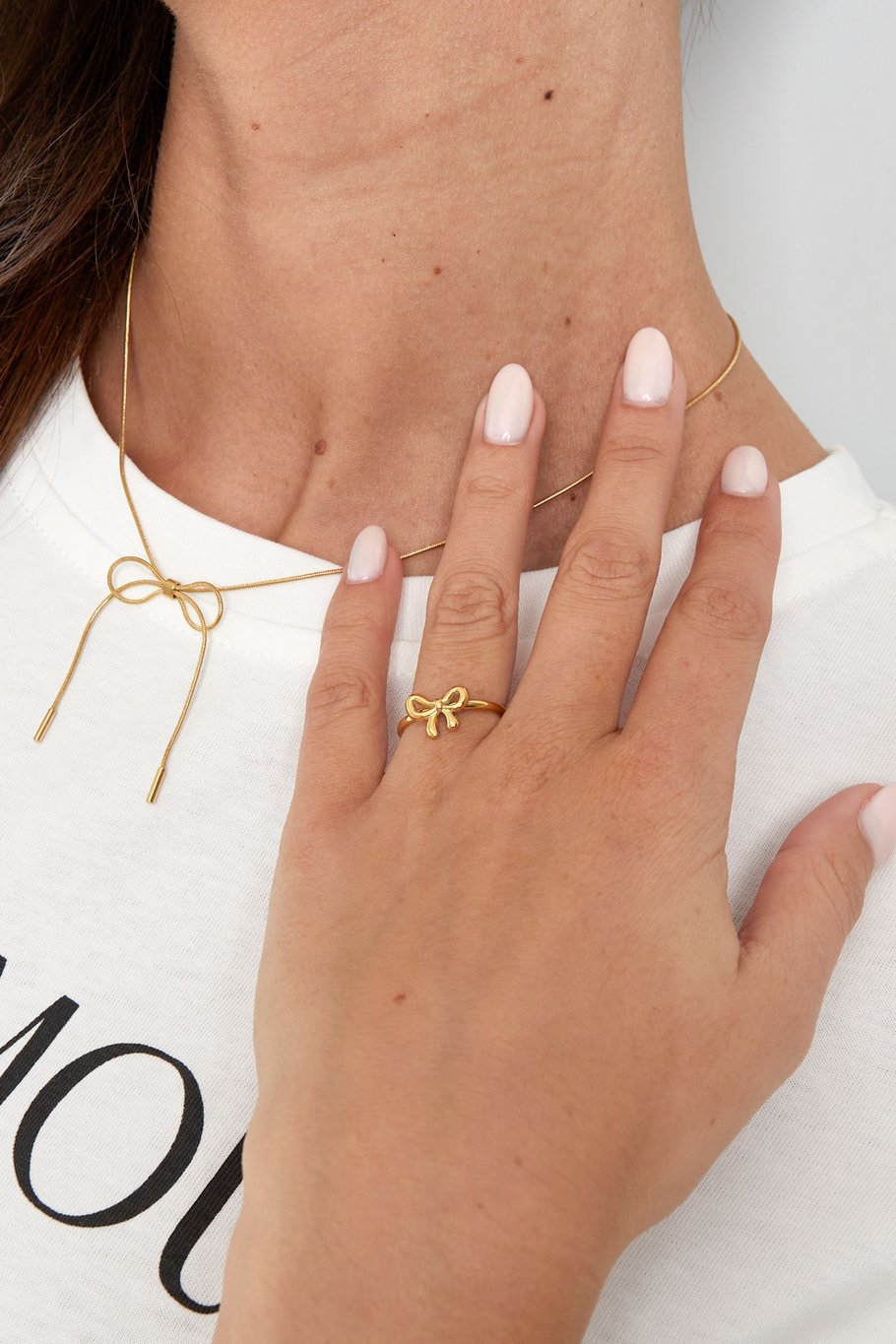 klein strikjes ring goudkleur 