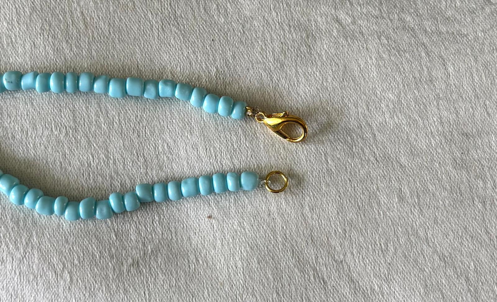 Licht blauw ketting met bedeltje