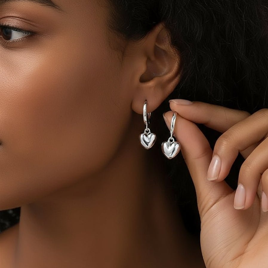zilverkleurige oorbellen met hartjes hanger 
